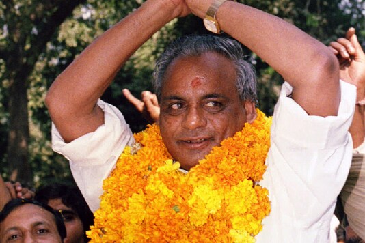 In this October 27, 1994 file photo, former UP chief minister Kalyan Singh waves to supporters in New Delhi. Singh was heading the BJP government in Uttar Pradesh when the Babri Masjid was demolished on December 6, 1992. (Kamal Kishore/Reuters)