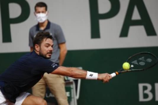 Switzerland's Stan Wawrinka plays a shot against Germany's Dominik Koepfe (Photo Credit: AP)