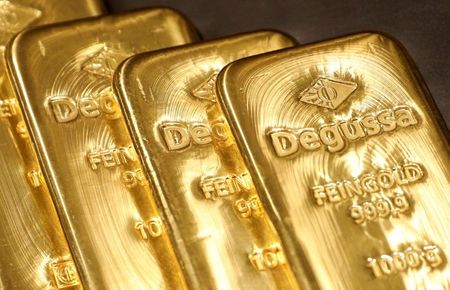 Gold Rises To Two-week High As Dollar Stumbles