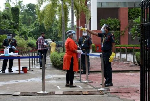 India's Coronavirus Surge Eases Slightly As Millions Take Exams, Pubs Reopen