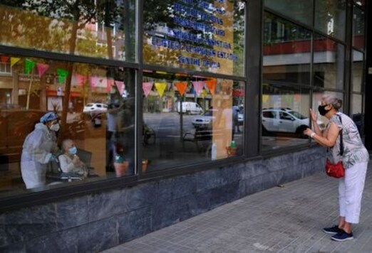 Spanish Nursing Home Residents Greet Friends, Family From Behind Windows