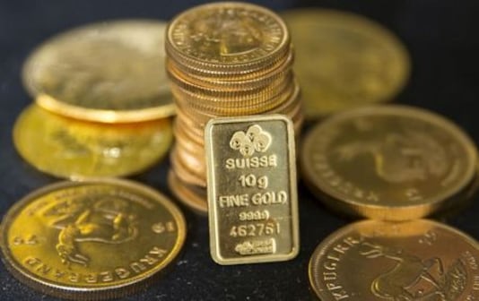 Gold Edges Up On Economic Woes, Firm Dollar Caps Gains