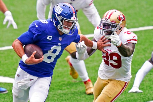 New York Giants quarterback Daniel Jones (8) tries to keep San Francisco 49ers' Jaquiski Tartt away during the second half of an NFL football game, Sunday, Sept. 27, 2020, in East Rutherford, N.J. (AP Photo/Corey Sipkin)