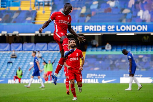 Liverpool's Sadio Mane celebrates after scoring during the English Premier League soccer match between Chelsea and Liverpool at Stamford Bridge Stadium, Sunday, Sept. 20, 2020. (AP Photo/Matt Dunham, Pool)
