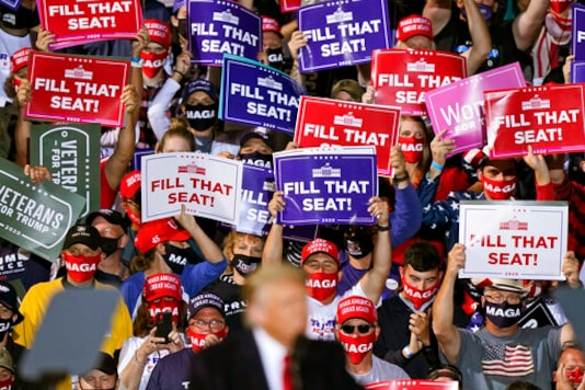 Supporters of President Donald Trump hold up signs as he speaks at a campaign rally, Monday, Sept. 21, 2020, in Swanton, Ohio. (AP Photo/Tony Dejak) Supporters of President Donald Trump hold up signs as he speaks at a campaign rally, Monday, Sept. 21, 2020, in Swanton, Ohio. (AP Photo/Tony Dejak)