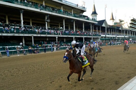 Jockey John Velazquez riding Authentic, wins the 146th running of the Kentucky Derby at Churchill Downs, Saturday, Sept. 5, 2020, in Louisville, Ky. (AP Photo/Jeff Roberson)