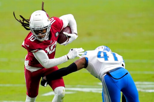 Arizona Cardinals wide receiver DeAndre Hopkins (10) eludes the grasp of Detroit Lions cornerback Chris Jones (41) during the second half of an NFL football game, Sunday, Sept. 27, 2020, in Glendale, Ariz. (AP Photo/Ross D. Franklin) Arizona Cardinals wide receiver DeAndre Hopkins (10) eludes the grasp of Detroit Lions cornerback Chris Jones (41) during the second half of an NFL football game, Sunday, Sept. 27, 2020, in Glendale, Ariz. (AP Photo/Ross D. Franklin)