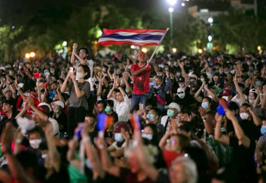 Pro-democracy protesters wave the national flag at the Sanam Luang field during a protest in Bangkok, Thailand, Saturday, Sept. 19, 2020. Thousands of demonstrators turned out Saturday for a rally to support the student-led protest movement's demands for new elections and reform of the monarchy. (AP Photo/Wason Wanichakorn) Pro-democracy protesters wave the national flag at the Sanam Luang field during a protest in Bangkok, Thailand, Saturday, Sept. 19, 2020. Thousands of demonstrators turned out Saturday for a rally to support the student-led protest movement's demands for new elections and reform of the monarchy. (AP Photo/Wason Wanichakorn)
