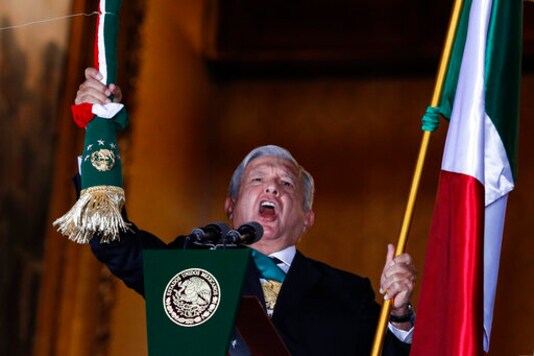 Mexican President Andres Manuel Lopez Obrador rings the bell as he gives the annual independence shout from the balcony of the National Palace to kick off subdued Independence Day celebrations amid the ongoing coronavirus pandemic, at the Zocalo in Mexico City, Tuesday, Sept. 15, 2020. Instead of the throngs of supporters who pack the Zocalo in a typical year, this Independence Day the president faced an empty plaza as he gave the traditional Mexican President Andres Manuel Lopez Obrador rings the bell as he gives the annual independence shout from the balcony of the National Palace to kick off subdued Independence Day celebrations amid the ongoing coronavirus pandemic, at the Zocalo in Mexico City, Tuesday, Sept. 15, 2020. Instead of the throngs of supporters who pack the Zocalo in a typical year, this Independence Day the president faced an empty plaza as he gave the traditional