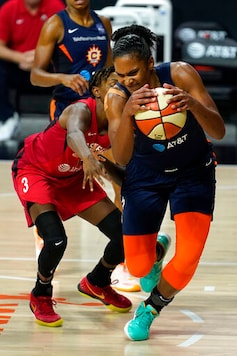 Connecticut Sun forward Alyssa Thomas (25) grabs a loose ball away from Las Vegas Aces guard Danielle Robinson (3) during the second half of Game 3 of a WNBA basketball semifinal round playoff series Thursday, Sept. 24, 2020, in Bradenton, Fla. (AP Photo/Chris O'Meara) Connecticut Sun forward Alyssa Thomas (25) grabs a loose ball away from Las Vegas Aces guard Danielle Robinson (3) during the second half of Game 3 of a WNBA basketball semifinal round playoff series Thursday, Sept. 24, 2020, in Bradenton, Fla. (AP Photo/Chris O'Meara)