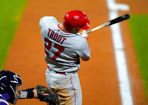 Los Angeles Angels' Mike Trout flies out against Colorado Rockies starting pitcher German Marquez in the fifth inning of a baseball game Friday, Sept. 11, 2020, in Denver. (AP Photo/David Zalubowski)