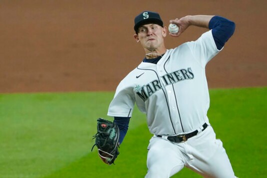 Seattle Mariners starting pitcher Nick Margevicius throws against the Houston Astros during the first inning of a baseball game, Wednesday, Sept. 23, 2020, in Seattle. (AP Photo/Ted S. Warren)
