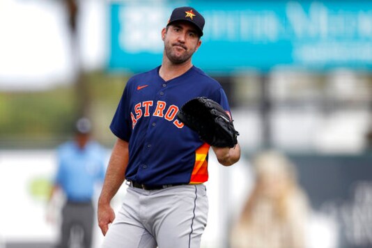 FILE - In this March 3, 2020, file photo, Houston Astros pitcher Justin Verlander reacts after a pitch during the third inning of a spring training baseball game against the St. Louis Cardinals in Jupiter, Fla.  The Astros announced Saturday, Sept. 19, 2020, that Verlander needs Tommy John surgery and could miss the entire 2021 season.  (AP Photo/Julio Cortez)