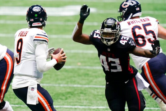 Chicago Bears quarterback Nick Foles (9) works against the Atlanta Falcons during the second half of an NFL football game, Sunday, Sept. 27, 2020, in Atlanta. (AP Photo/Brynn Anderson) Chicago Bears quarterback Nick Foles (9) works against the Atlanta Falcons during the second half of an NFL football game, Sunday, Sept. 27, 2020, in Atlanta. (AP Photo/Brynn Anderson)