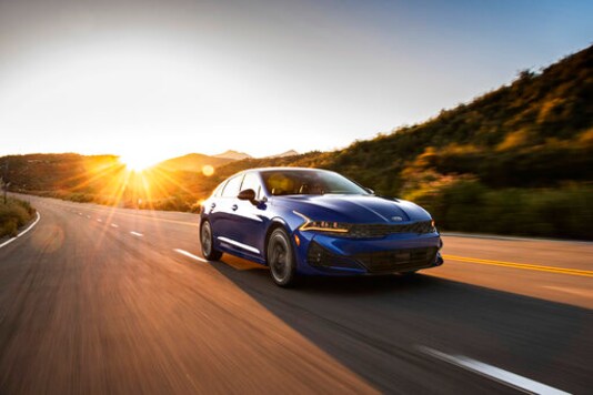 This photo provided by Kia Motors America shows the all-new 2021 Kia K5, which Edmunds compares against the top-rated Honda Accord. These midsize family sedans are confident, capable and practical, but which one will win? (Robin Trajano/Kia Motors America via AP)