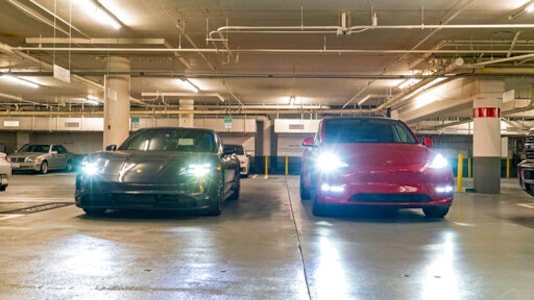This photo provided by Edmunds shows a 2020 Porsche Taycan and 2020 Tesla Model Y Performance at the beginning of a daylong range and consumption test. The results would eventually show the Taycan outperforming its EPA range estimates by nearly 60%, while the Tesla Model Y was pretty spot-on with its EPA figures. (Rex Tokeshi-Torres/Edmunds via AP) This photo provided by Edmunds shows a 2020 Porsche Taycan and 2020 Tesla Model Y Performance at the beginning of a daylong range and consumption test. The results would eventually show the Taycan outperforming its EPA range estimates by nearly 60%, while the Tesla Model Y was pretty spot-on with its EPA figures. (Rex Tokeshi-Torres/Edmunds via AP)