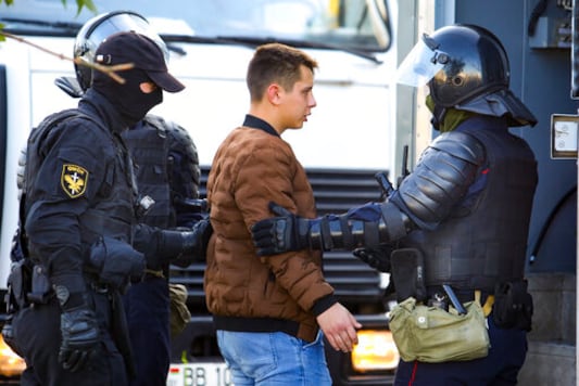 Police detain a protester during an opposition rally to protest the official presidential election results in Minsk, Belarus, Saturday, Sept. 19, 2020. Protests calling for the authoritarian president's resignation broke out after an Aug. 9 election that officials say gave him a sixth term in office and that opponents say was rigged. (AP Photo/TUT.by)