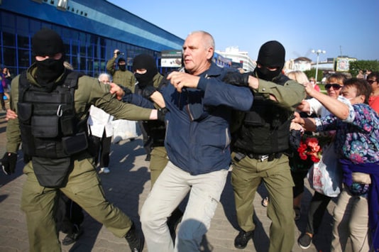 Police detain a protester during an opposition rally to protest the official presidential election results in Minsk, Belarus, Saturday, Sept. 26, 2020. Hundreds of thousands of Belarusians have been protesting daily since the Aug. 9 presidential election. (AP Photo/TUT.by)