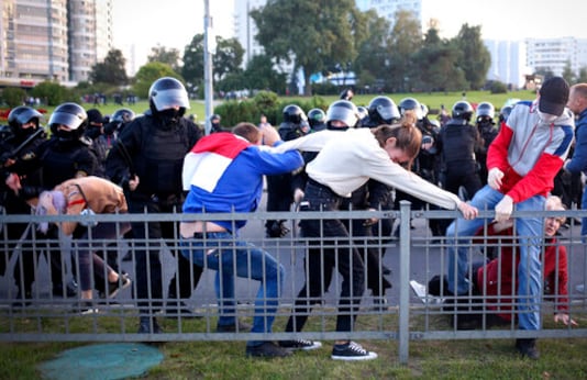 Riot police detain protesters during an opposition rally to protest the presidential inauguration in Minsk, Belarus, Wednesday, Sept. 23, 2020. Belarus President Alexander Lukashenko has been sworn in to his sixth term in office at an inaugural ceremony that was not announced in advance amid weeks of huge protests saying the authoritarian leader's reelection was rigged. Hundreds took to the streets in several cities in the evening to protest the inauguration. (AP Photo/TUT.by)