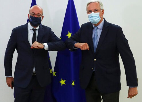 European Commission's Head of Task Force for Relations with the United Kingdom Michel Barnier, right, meets with European Council President Charles Michel at the EU Council building in Brussels, Friday, Sept. 18, 2020. (Yves Herman, Pool via AP)