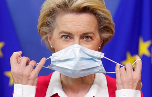 European Commission President Ursula von der Leyen removes her face mask before giving a statement at the European Commission headquarters in Brussels, Wednesday, Sept. 23, 2020. (Stephanie Lecocq/Pool Photo via AP)