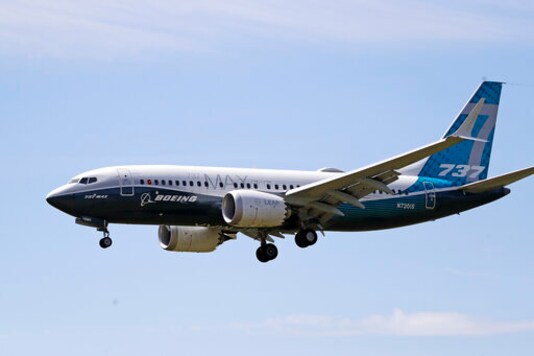 FILE - In this Monday, June 29, 2020, file photo, a Boeing 737 Max jet heads to a landing at Boeing Field following a test flight in Seattle. A U.S. House committee is questioning whether Boeing and the Federal Aviation Administration have recognized problems that caused two deadly 737 Max jet crashes and if either organization will be willing to make significant changes to fix them. (AP Photo/Elaine Thompson, File) FILE - In this Monday, June 29, 2020, file photo, a Boeing 737 Max jet heads to a landing at Boeing Field following a test flight in Seattle. A U.S. House committee is questioning whether Boeing and the Federal Aviation Administration have recognized problems that caused two deadly 737 Max jet crashes and if either organization will be willing to make significant changes to fix them. (AP Photo/Elaine Thompson, File)