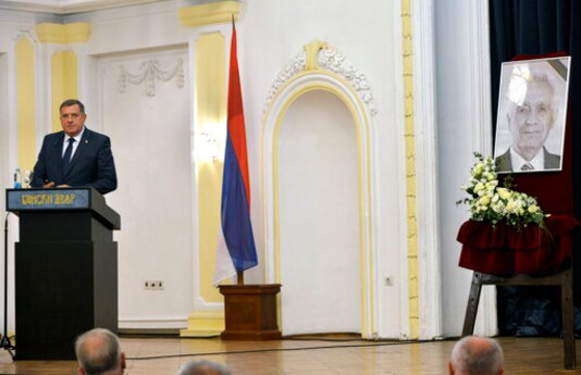 Bosnian Serb official, Milorad Dodik, who is the member of Bosnia's multi-ethnic presidency speaks during an official commemoration ceremony for Momcilo Krajisnik, wartime parliament speaker in Banja Luka, Bosnia, Wednesday, Sept. 16, 2020. Bosnian Serb authorities on Wednesday held an official commemoration ceremony for a former wartime top leader who died of COVID-19, despite his war crimes conviction by a U.N. court. Bosnian Serb president, prime minister and other officials attended the ceremony in the northern city of Banja Luka, the seat of the Serb-run part of Bosnia. (AP Photo/Radivoje Pavicic)