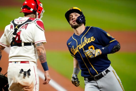 Milwaukee Brewers' Ryan Braun, right, scores past St. Louis Cardinals catcher Yadier Molina after hitting a solo home run during the fourth inning of a baseball game Saturday, Sept. 26, 2020, in St. Louis. (AP Photo/Jeff Roberson) Milwaukee Brewers' Ryan Braun, right, scores past St. Louis Cardinals catcher Yadier Molina after hitting a solo home run during the fourth inning of a baseball game Saturday, Sept. 26, 2020, in St. Louis. (AP Photo/Jeff Roberson)