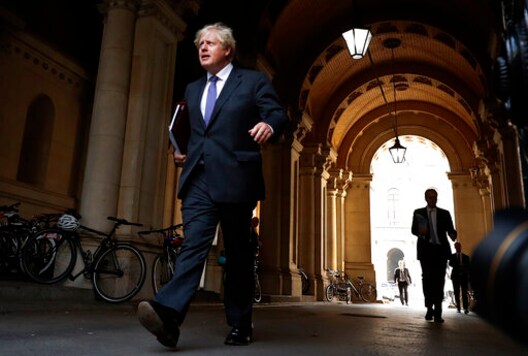 Britain's Prime Minister Boris Johnson walks to his office in Downing Street after a cabinet meeting in London, Tuesday, Sept. 15, 2020.(AP Photo/Frank Augstein)