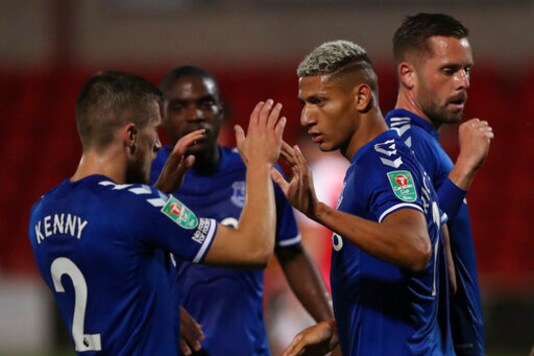 Everton's Richarlison, right, celebrates after scoring his side's opening goal during the English League Cup third round soccer match between Fleetwood Town and Everton at the Highbury Stadium in Fleetwood, England, Wednesday, Sept. 23, 2020. (Alex Livesey/Pool via AP)