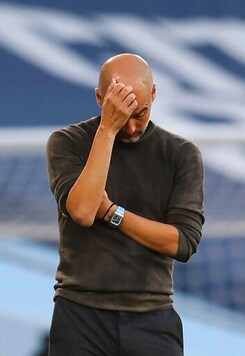 Manchester City's head coach Pep Guardiola reacts after Leicester scored their 4th goal of the game during the English Premier League soccer match between Manchester City and Leicester City at the Etihad stadium in Manchester, England, Sunday, Sept. 27, 2020. (Catherine Ivill/Pool via AP)