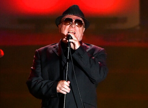 FILE - In this June 18, 2015 file photo, Van Morrison performs at the 46th annual Songwriters Hall of Fame Induction and Awards Gala in New York. Van Morrison is to release three new songs over the coming weeks that take a swipe at the lockdown restrictions imposed by the British government. In No More Lockdown, the Northern Irishman says the curbs enslave people, effectively labels the government as fascist bullies, condemns celebrities for telling us what we are supposed to feel and charges scientists for making up crooked facts. (Photo by Evan Agostini/Invision/AP, File) FILE - In this June 18, 2015 file photo, Van Morrison performs at the 46th annual Songwriters Hall of Fame Induction and Awards Gala in New York. Van Morrison is to release three new songs over the coming weeks that take a swipe at the lockdown restrictions imposed by the British government. In No More Lockdown, the Northern Irishman says the curbs enslave people, effectively labels the government as fascist bullies, condemns celebrities for telling us what we are supposed to feel and charges scientists for making up crooked facts. (Photo by Evan Agostini/Invision/AP, File)