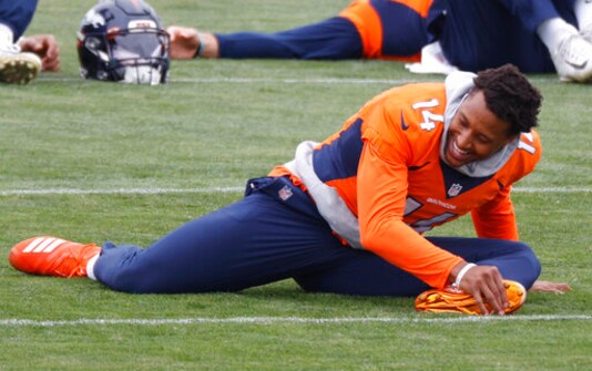 Denver Broncos wide receiver Courtland Sutton stretches before taking part in drills during an NFL football practice Thursday, Sept. 10, 2020, in Englewood, Colo. (AP Photo/David Zalubowski)