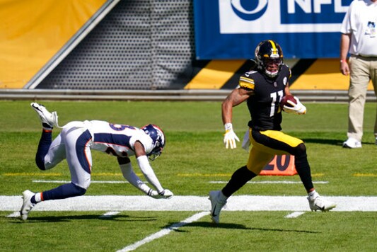 Pittsburgh Steelers wide receiver Chase Claypool (11) gets past Denver Broncos cornerback Michael Ojemudia (23) on an 84 yard touchdown play during the first half of an NFL football game, Sunday, Sept. 20, 2020, in Pittsburgh. (AP Photo/Keith Srakocic)