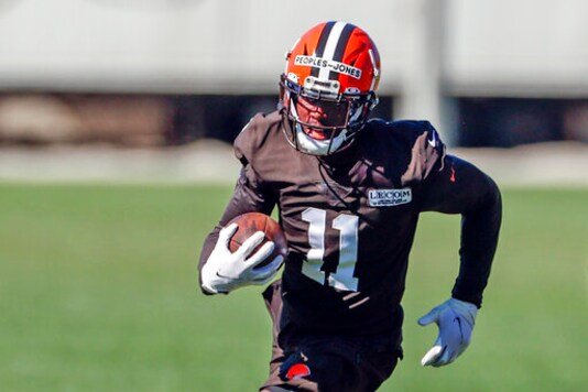 FILE- In this Aug. 20, 2020, file photo, Cleveland Browns wide receiver Donovan Peoples-Jones returns a punt during practice at the NFL football team's training facility in Berea, Ohio. With the loss of return specialist and wide receiver Jojo Natson to a season-ending injury, rookie Donovan Peoples-Jones, a sixth-round pick from Michigan who was inactive last weekend, could get more playing time. (AP Photo/Ron Schwane, File)