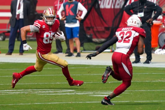 San Francisco 49ers tight end George Kittle (85) runs against Arizona Cardinals strong safety Budda Baker (32) during the first half of an NFL football game in Santa Clara, Calif., Sunday, Sept. 13, 2020. (AP Photo/Tony Avelar) San Francisco 49ers tight end George Kittle (85) runs against Arizona Cardinals strong safety Budda Baker (32) during the first half of an NFL football game in Santa Clara, Calif., Sunday, Sept. 13, 2020. (AP Photo/Tony Avelar)