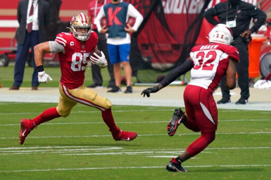 San Francisco 49ers tight end George Kittle (85) runs against Arizona Cardinals strong safety Budda Baker (32) during the first half of an NFL football game in Santa Clara, Calif., Sunday, Sept. 13, 2020. (AP Photo/Tony Avelar)