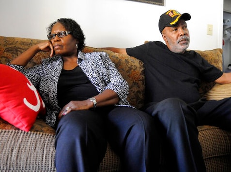 FILE - In this Nov. 16, 2016 file photo, Sarah Collins Rudolph and her husband, George Rudolph, discuss their worries about the upcoming Donald Trump presidency in their home in Birmingham, Ala..  Rudolph, the survivor of the 1963 church bombing that killed four little girls, is seeking an apology and restitution from the state of Alabama.  (AP Photo/Jay Reeves)