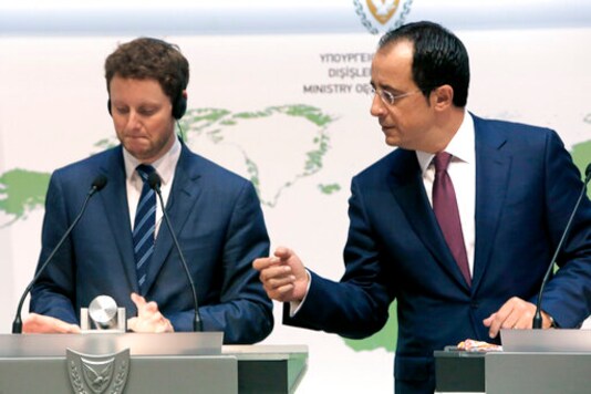 France's Minister for European Affairs Clement Beaune, left, and Cyprus' Foreign Minister Nikos Christodoulides take part in a news conference at the Foreign Ministry building in the capital Nicosia, Friday, Sept. 18, 2020. Beaune says the European Union should consider imposing sanctions against Turkey if the country continues a hydrocarbons search inside waters where Greece and Cyprus claims exclusive rights. (AP Photo/Petros Karadjias) France's Minister for European Affairs Clement Beaune, left, and Cyprus' Foreign Minister Nikos Christodoulides take part in a news conference at the Foreign Ministry building in the capital Nicosia, Friday, Sept. 18, 2020. Beaune says the European Union should consider imposing sanctions against Turkey if the country continues a hydrocarbons search inside waters where Greece and Cyprus claims exclusive rights. (AP Photo/Petros Karadjias)