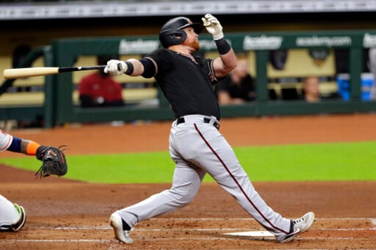Arizona Diamondbacks' Kole Calhoun watches his home run during the second inning of a baseball game against the Houston Astros Saturday, Sept. 19, 2020, in Houston. (AP Photo/Michael Wyke) Arizona Diamondbacks' Kole Calhoun watches his home run during the second inning of a baseball game against the Houston Astros Saturday, Sept. 19, 2020, in Houston. (AP Photo/Michael Wyke)