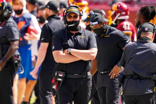 Washington Football Team head coach Ron Rivera, walking on the sidelines during the first half of an NFL football game against the Philadelphia Eagles, Sunday, Sept. 13, 2020, in Landover, Md. (AP Photo/Alex Brandon)