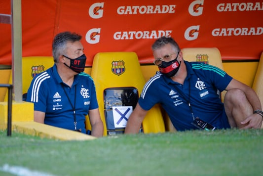 Coach Dominic Torrent of Brazil's Flamengo, left, talks with a technical adviser during a Copa Libertadores soccer match against Ecuador's Barcelona in Guayaquil, Ecuador, Tuesday, Sept. 22, 2020. (Rodrigo Buendia/POOL via AP) Coach Dominic Torrent of Brazil's Flamengo, left, talks with a technical adviser during a Copa Libertadores soccer match against Ecuador's Barcelona in Guayaquil, Ecuador, Tuesday, Sept. 22, 2020. (Rodrigo Buendia/POOL via AP)