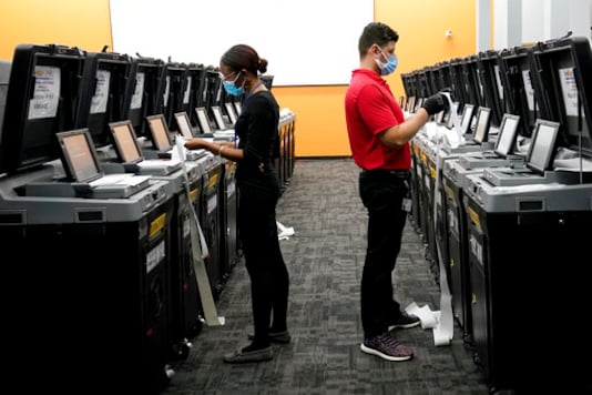 Employees at the Broward Supervisor of Elections Office conduct logic and accuracy testing of equipment used for counting ballots, Thursday, Sept. 24, 2020, in Lauderhill, Fla. Vote-by-mail ballots for the general election will begin going out to residents in Broward County Thursday. (AP Photo/Lynne Sladky)