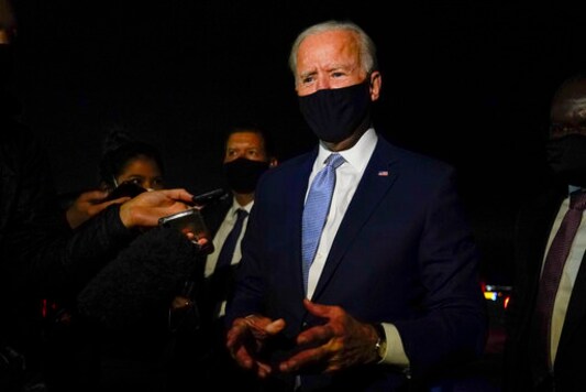 Democratic presidential candidate former Vice President Joe Biden talks with reporters at Wilkes-Barre Scranton International Airport, in Avoca, Pa., after a CNN town hall Thursday, Sept. 17, 2020. (AP Photo/Carolyn Kaster)