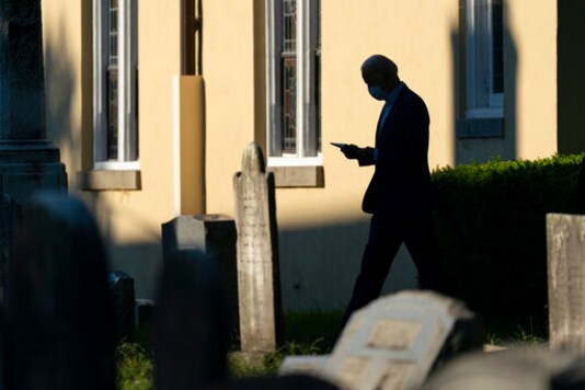 Democratic presidential candidate and former vice president Joe Biden walks from St. Joseph on the Brandywine, a Roman Catholic Church, after attending mass in Wilmington, Del., Sunday, Sept. 20, 2020. (AP Photo/Carolyn Kaster)