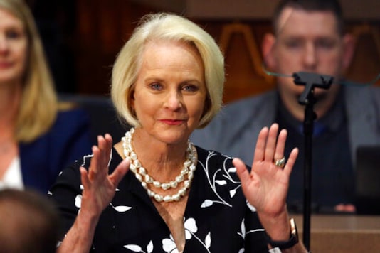 FILE - In this Jan. 13, 2020, file photo Cindy McCain, wife of former Arizona Sen. John McCain, waves to the crowd after being acknowledged by Arizona Republican Gov. Doug Ducey during his State of the State address on the opening day of the legislative session at the Capitol in Phoenix. Democratic presidential candidate former Vice President Joe Biden said Sept. 22 that Cindy McCain plans to endorse him for president. (AP Photo/Ross D. Franklin, File)