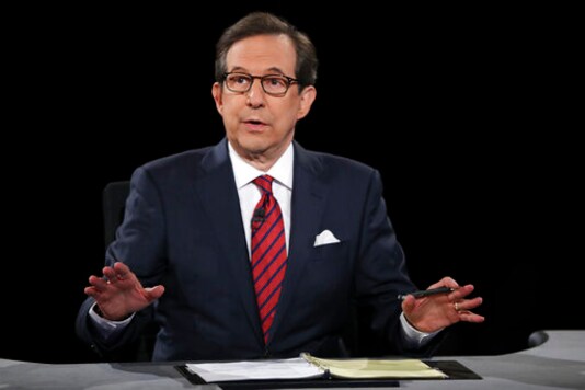 FILE - In this Oct. 19, 2016 file photo, moderator Chris Wallace guides the discussion during the presidential debate at UNLV in Las Vegas. All eyes are on Fox's Chris Wallace as he prepares to moderate the first presidential debate. Wallace is the only journalist moderating one of the four debates this fall who has been there before: he was the onstage referee for the third meeting between President Donald Trump and Hillary Clinton. (Joe Raedle/Pool via AP, File) FILE - In this Oct. 19, 2016 file photo, moderator Chris Wallace guides the discussion during the presidential debate at UNLV in Las Vegas. All eyes are on Fox's Chris Wallace as he prepares to moderate the first presidential debate. Wallace is the only journalist moderating one of the four debates this fall who has been there before: he was the onstage referee for the third meeting between President Donald Trump and Hillary Clinton. (Joe Raedle/Pool via AP, File)