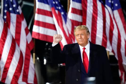 President Donald Trump pumps his fist before speaking at a campaign rally, Monday, Sept. 21, 2020, in Swanton, Ohio. (AP Photo/Tony Dejak) President Donald Trump pumps his fist before speaking at a campaign rally, Monday, Sept. 21, 2020, in Swanton, Ohio. (AP Photo/Tony Dejak)