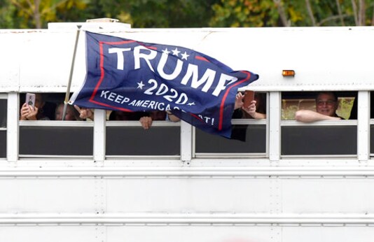 Supporters of President Donald Trump arrive by bus for a Trump campaign rally at Harrisburg International Airport, Saturday, Sept. 26, 2020, in Middletown, Pa. (AP Photo/Steve Ruark)