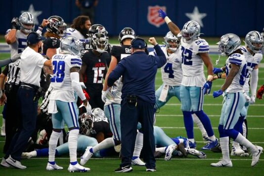 Dallas Cowboys head coach Mike McCarthy, center with hand raised, celebrates an onside kick recovery in the second half of an NFL football game against the Atlanta Falcons in Arlington, Texas, Sunday, Sept. 20, 2020. (AP Photo/Ron Jenkins) Dallas Cowboys head coach Mike McCarthy, center with hand raised, celebrates an onside kick recovery in the second half of an NFL football game against the Atlanta Falcons in Arlington, Texas, Sunday, Sept. 20, 2020. (AP Photo/Ron Jenkins)
